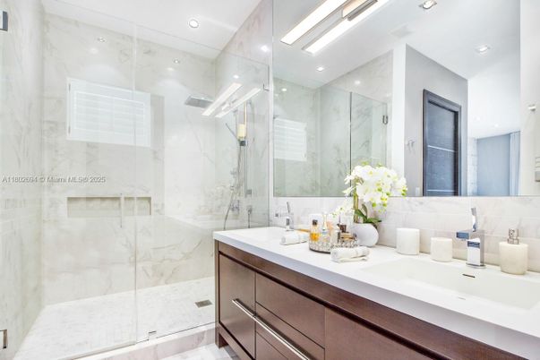 Bathroom, Dual Sink Vanities, Glass Shower, Interior, Marble Walls, Recessed Lighting