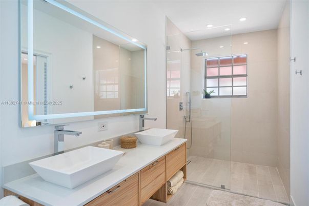 Bathroom, Dual Sink Vanities, Glass Shower, Interior, Recessed Lighting, Wood Texture Flooring