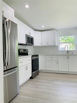 Interior, Kitchen, Recessed Lighting, Stainless Steel Appliances, Wood Texture Flooring