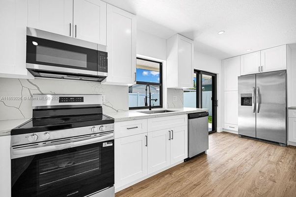 Interior, Kitchen, Recessed Lighting, Stainless Steel Appliances, Wood Texture Flooring