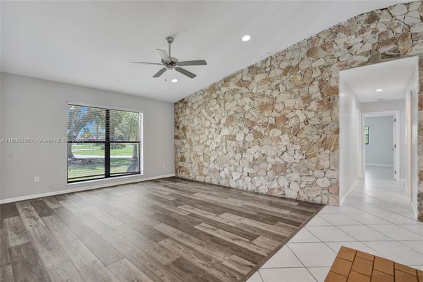 Empty room, Interior, Recessed Lighting, Stone Walls, Wood Texture Flooring