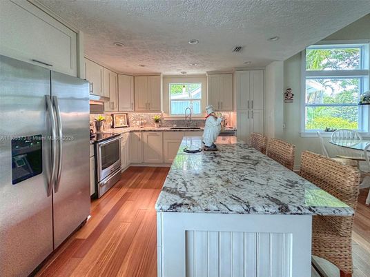 Dining room, Interior, Kitchen, Recessed Lighting, Stainless Steel Appliances, Wood Texture Flooring