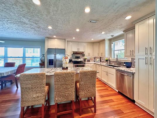 Dining room, Interior, Kitchen, Recessed Lighting, Stainless Steel Appliances, Wood Texture Flooring