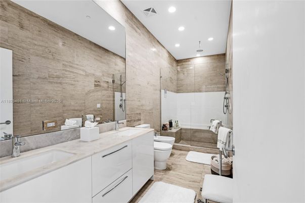 Bathroom, Dual Sink Vanities, Glass Shower, Interior, Recessed Lighting, Wood Texture Flooring
