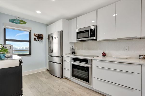 Interior, Kitchen, Recessed Lighting, Stainless Steel Appliances, Water, Wood Texture Flooring