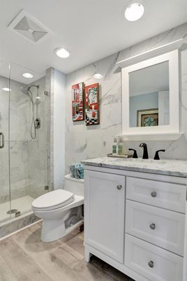 Bathroom, Glass Shower, Interior, Marble Walls, Recessed Lighting, Wood Texture Flooring