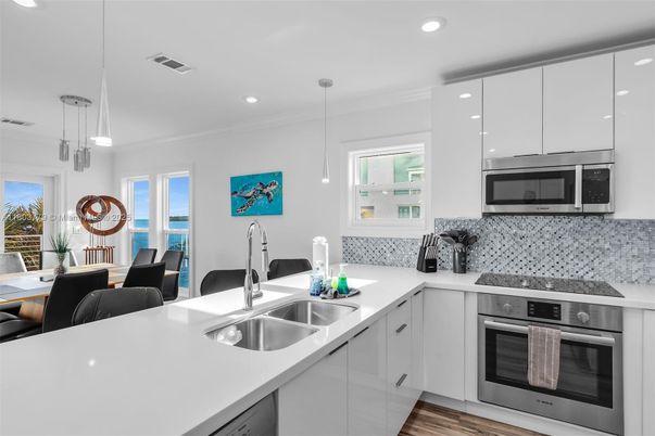 Interior, Kitchen, Pendant Lights, Recessed Lighting, Stainless Steel Appliances, Water, Wood Texture Flooring