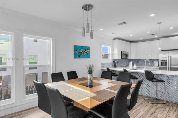 Dining room, Interior, Kitchen, Pendant Lights, Recessed Lighting, Stainless Steel Appliances, Wood Texture Flooring