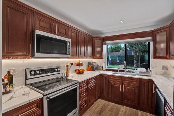 Interior, Kitchen, Recessed Lighting, Stainless Steel Appliances, Wood Texture Flooring