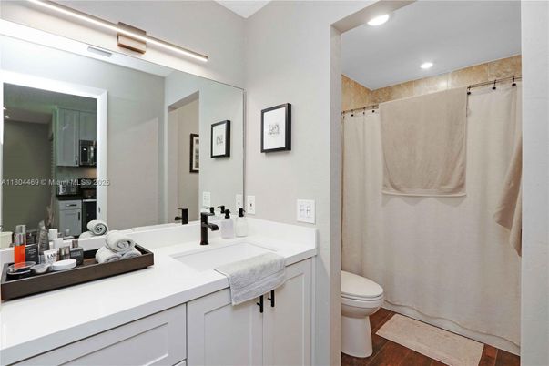 Bathroom, Dual Sink Vanities, Interior, Recessed Lighting, Wood Texture Flooring