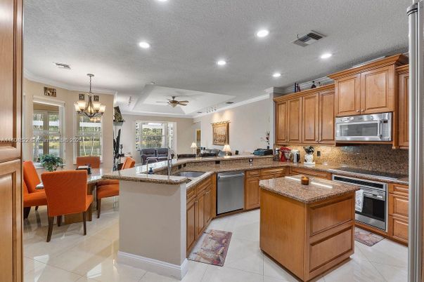 Chandelier, Dining room, Interior, Kitchen, Living room, Recessed Lighting, Stainless Steel Appliances