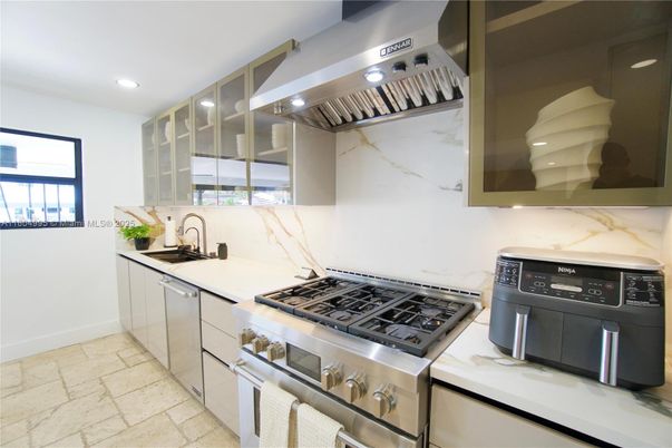 Interior, Kitchen, Marble Walls, Recessed Lighting, Stainless Steel Appliances