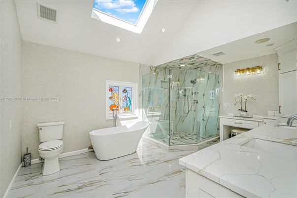 Bathroom, Dual Sink Vanities, Free Standing Baths, Glass Shower, Interior, Marble, Marble Walls, Recessed Lighting