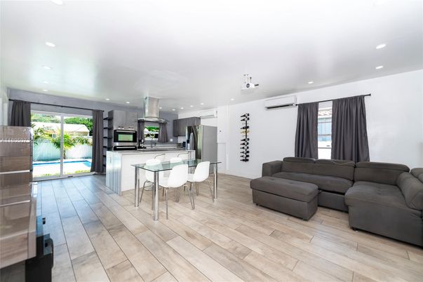 Dining room, Interior, Kitchen, Living room, Recessed Lighting, Stainless Steel Appliances, Wood Texture Flooring