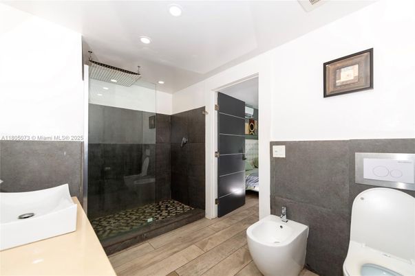 Bathroom, Free Standing Baths, Glass Shower, Interior, Recessed Lighting, Wood Texture Flooring