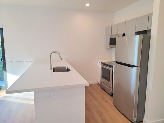 Interior, Kitchen, Recessed Lighting, Stainless Steel Appliances, Wood Texture Flooring