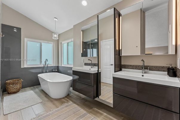 Bathroom, Dual Sink Vanities, Free Standing Baths, Interior, Pendant Lights, Recessed Lighting, Wood Texture Flooring