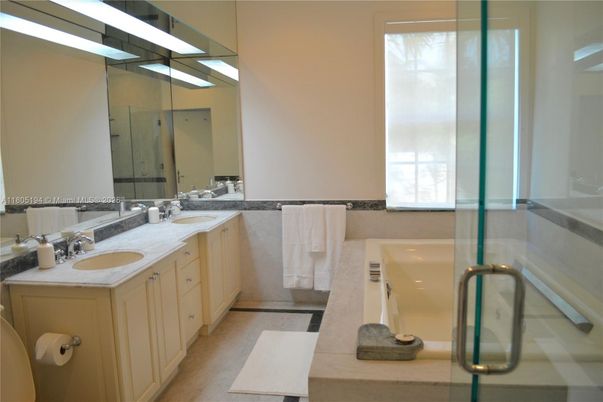 Bathroom, Dual Sink Vanities, Glass Shower, Interior, Wood Texture Flooring