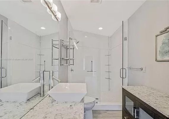 Bathroom, Free Standing Baths, Glass Shower, Interior, Recessed Lighting, Wood Texture Flooring