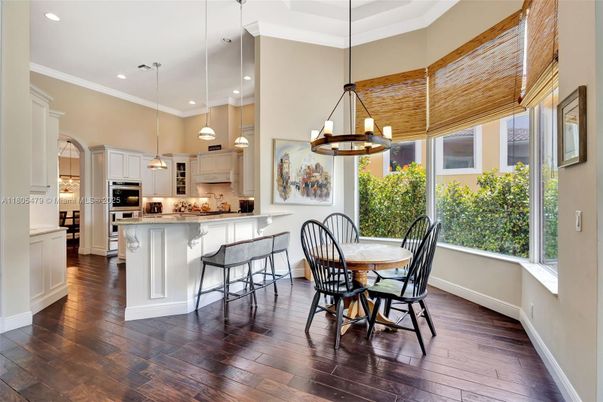 Chandelier, Dining room, Interior, Kitchen, Pendant Lights, Recessed Lighting, Stainless Steel Appliances, Wood Texture Flooring