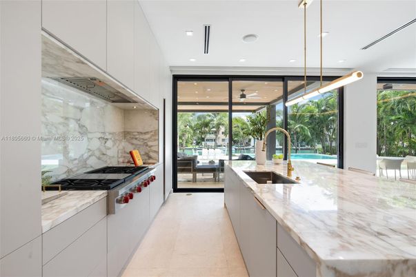 Interior, Kitchen, Marble Walls, Pendant Lights, Recessed Lighting, Stainless Steel Appliances