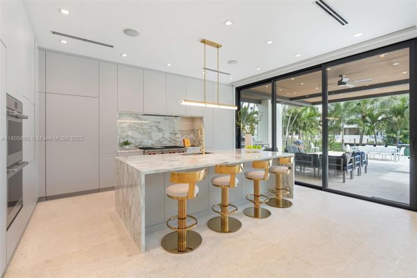 Interior, Kitchen, Marble Walls, Pendant Lights, Recessed Lighting, Stainless Steel Appliances