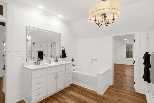 Bathroom, Chandelier, Dual Sink Vanities, Interior, Recessed Lighting, Wood Texture Flooring
