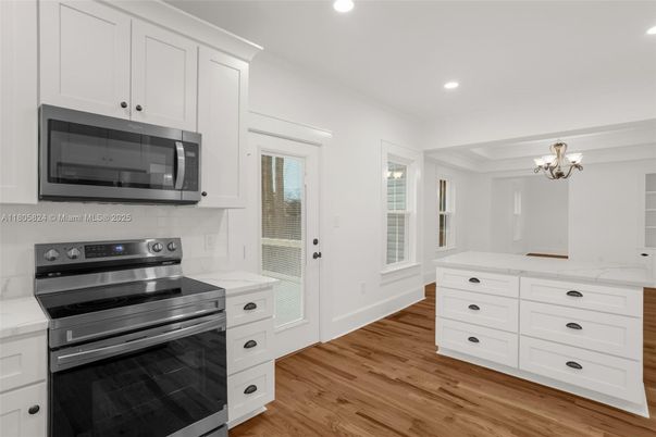 Chandelier, Interior, Kitchen, Recessed Lighting, Stainless Steel Appliances, Wood Texture Flooring