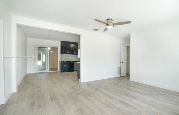 Empty room, Fireplace, Interior, Kitchen, Pendant Lights, Wood Texture Flooring
