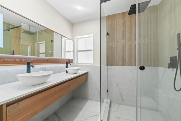 Bathroom, Dual Sink Vanities, Glass Shower, Interior, Marble, Marble Walls, Recessed Lighting