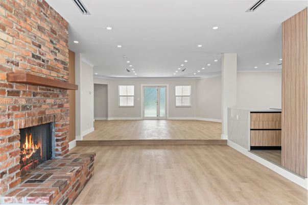 Empty room, Fireplace, Interior, Recessed Lighting, Stone Walls, Wood Texture Flooring