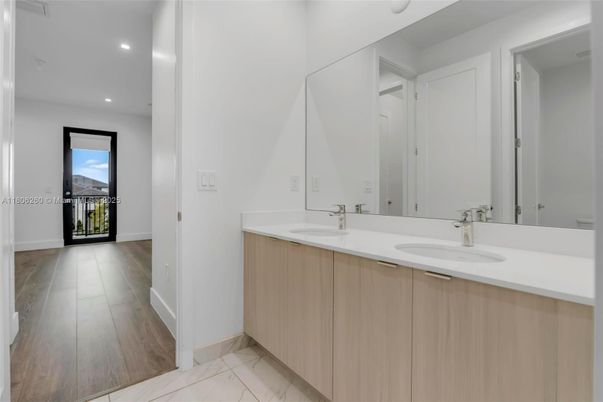 Bathroom, Dual Sink Vanities, Interior, Marble, Recessed Lighting, Wood Texture Flooring