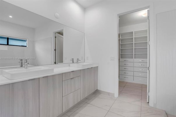 Bathroom, Dual Sink Vanities, Interior, Marble, Recessed Lighting, Walk-in Closets