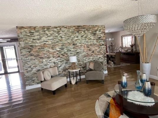 Chandelier, Dining room, Interior, Living room, Stone Walls, Wood Texture Flooring