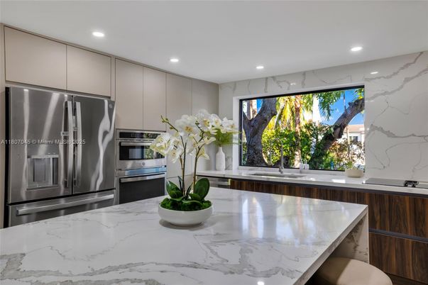 Interior, Kitchen, Marble Walls, Recessed Lighting, Stainless Steel Appliances