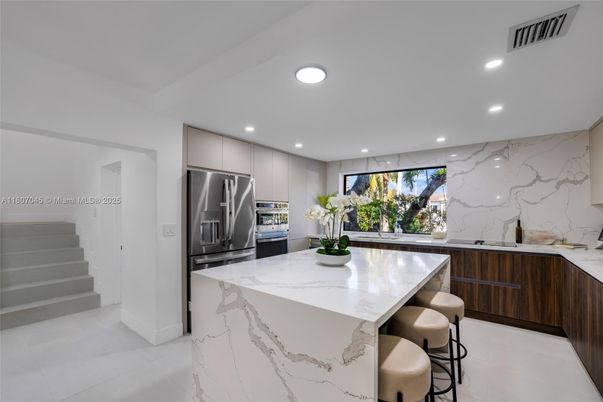 Interior, Kitchen, Marble Walls, Recessed Lighting, Stainless Steel Appliances