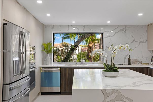 Interior, Kitchen, Marble Walls, Recessed Lighting, Stainless Steel Appliances