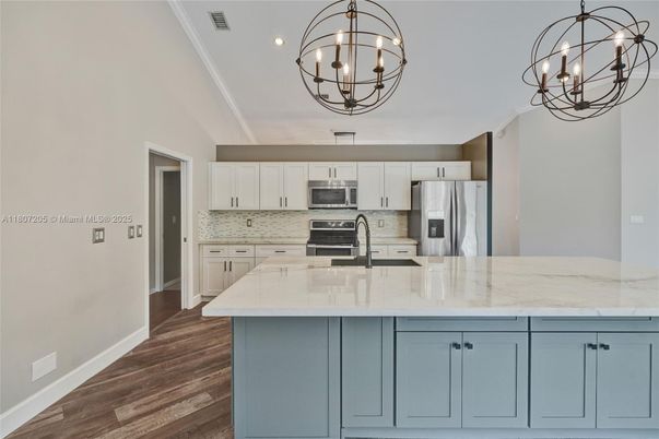 Chandelier, Interior, Kitchen, Recessed Lighting, Stainless Steel Appliances, Wood Texture Flooring