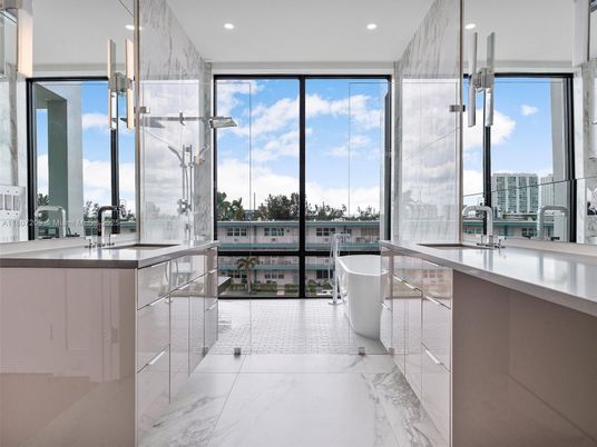Bathroom, Dual Sink Vanities, Free Standing Baths, Glass Shower, Interior, Marble, Marble Walls, Pendant Lights, Recessed Lighting, Water