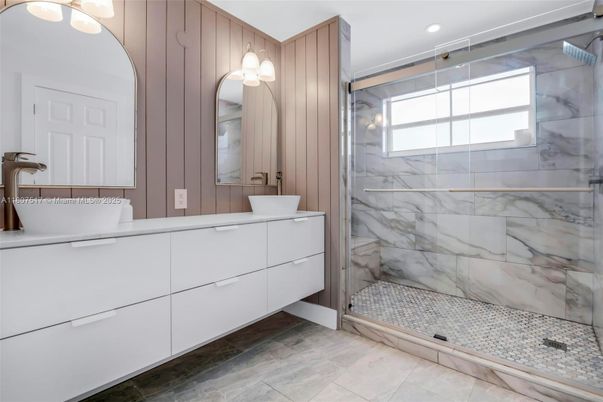Bathroom, Dual Sink Vanities, Glass Shower, Interior, Marble Walls, Recessed Lighting