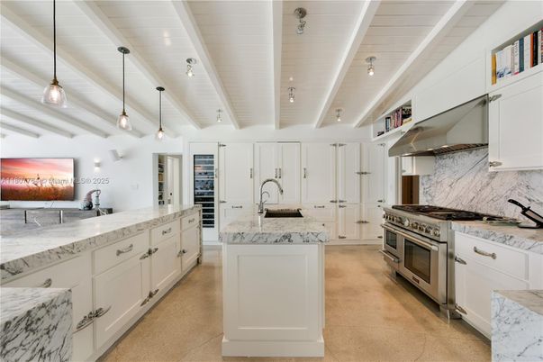 Interior, Kitchen, Marble Walls, Pendant Lights, Recessed Lighting, Stainless Steel Appliances