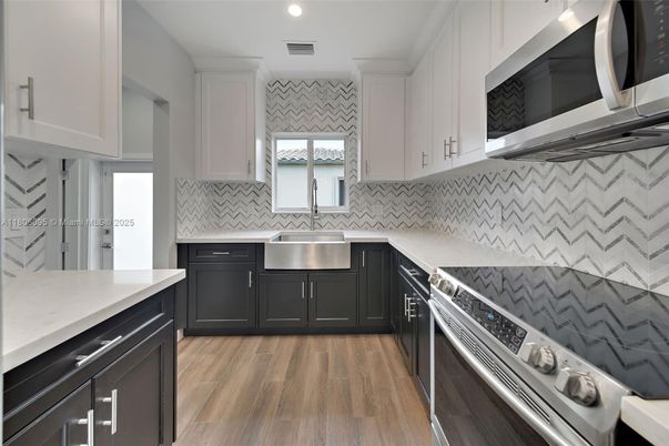 Interior, Kitchen, Recessed Lighting, Stainless Steel Appliances, Wood Texture Flooring