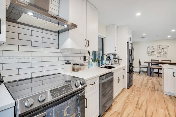 Dining room, Interior, Kitchen, Recessed Lighting, Stainless Steel Appliances, Wood Texture Flooring