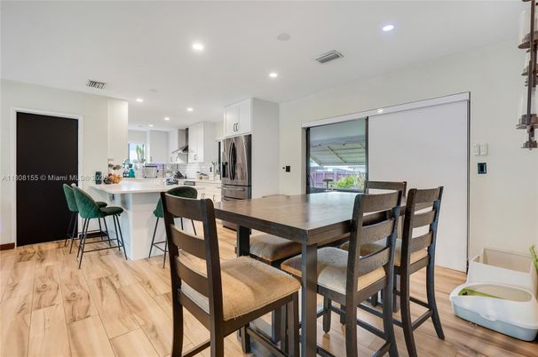 Dining room, Interior, Kitchen, Recessed Lighting, Stainless Steel Appliances, Wood Texture Flooring