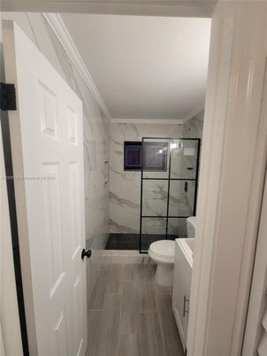 Bathroom, Glass Shower, Interior, Marble Walls, Wood Texture Flooring