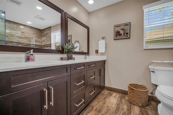 Bathroom, Dual Sink Vanities, Interior, Recessed Lighting, Wood Texture Flooring