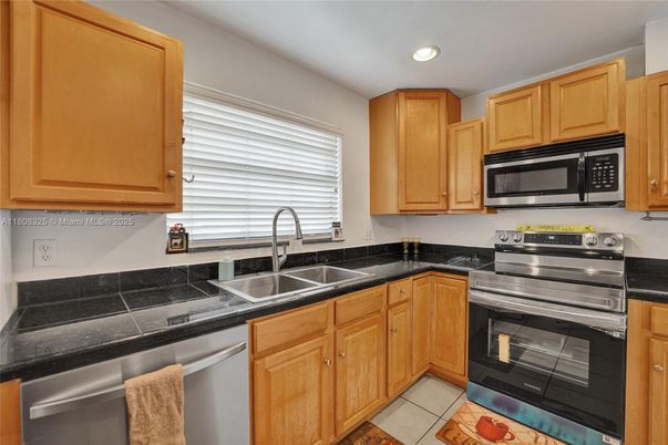 Interior, Kitchen, Recessed Lighting, Stainless Steel Appliances, Tile Countertops