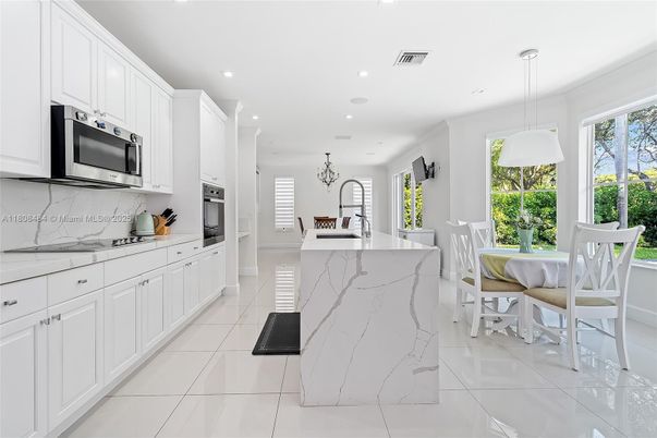 Dining room, Interior, Kitchen, Marble Walls, Pendant Lights, Recessed Lighting, Stainless Steel Appliances