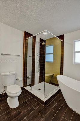 Bathroom, Free Standing Baths, Glass Shower, Interior, Wood Texture Flooring