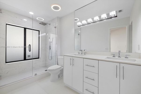Bathroom, Dual Sink Vanities, Glass Shower, Interior, Marble Walls, Recessed Lighting